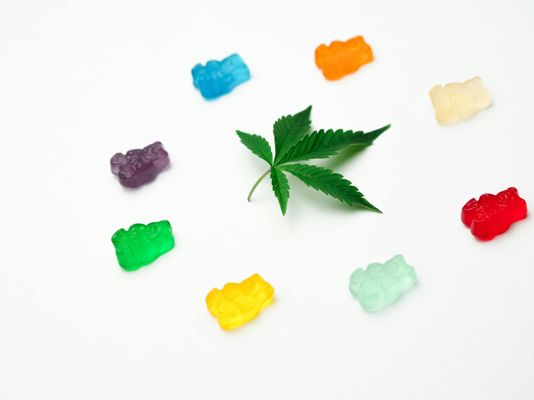 photo assorted colored gummy bears on white background